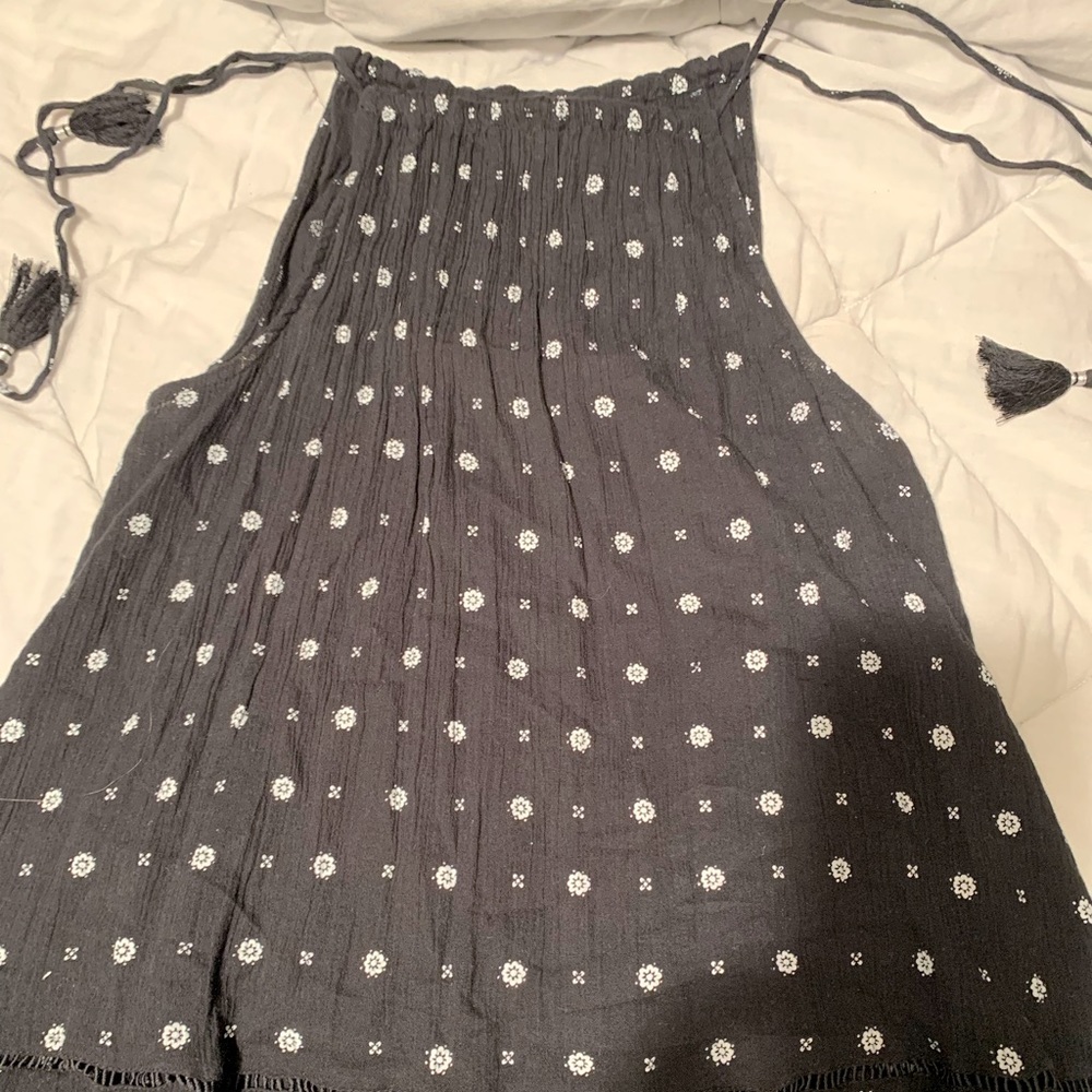 Black blouse ties at both shoulders